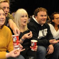 NK Theatre Arts staff watching a play with midshire donated popcorn