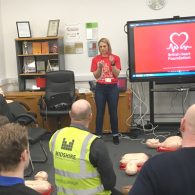 Natalie Bunyan from the British Heart Foundation a CPR course to Midshire's staff